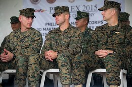 (from left to right) U.S. Marines Col. Michael P. Wylie, operations chief, Joint U.S. Military Assistance Group Philippines, Col. John Armellino Jr, chief of staff of the 3rd Marine Expeditionary Brigade, and Col. Romin Dasmalchi, commanding officer of the 31st Marine Expeditionary Unit, discuss their time in the Philippines at the closing ceremony of Amphibious Landing Exercise 15, Oct. 10, 2014. Philippine and U.S. service members attended the closing ceremony of PHIBLEX to celebrate the two-week long exercise that allows Philippine and U.S. armed forces to work cooperatively in range of military operations such as complex amphibious operations and disaster relief missions. PHIBLEX is an annual, bilateral training exercise conducted by members of the Armed Forces of the Philippines alongside U.S. Marine and Navy forces focused on strengthening the partnership and relationships between the two nations.