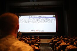 A recruit of Echo Company, 2nd Recruit Training Battalion, reads the definition of hazing to his fellow recruits at Marine Corps Recruit Depot San Diego, Oct. 7. This class was given to educate recruits about ways to prevent hazing if they see it. 