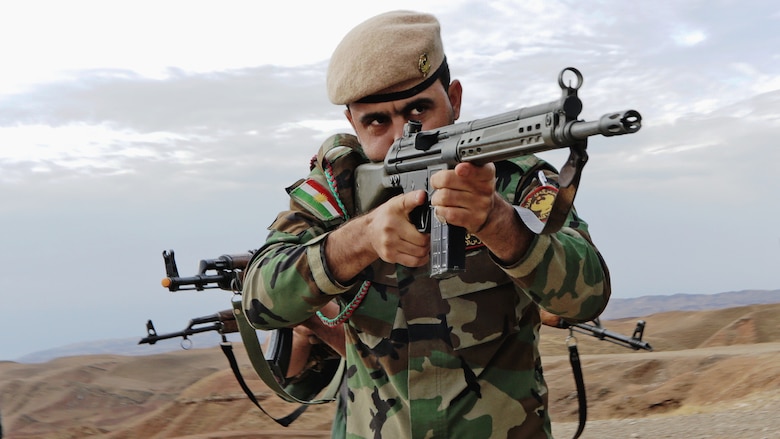 A Kurdish peshmerga soldier takes the lead during urban combat maneuvering training held near Irbil, Iraq, Oct. 29, 2015. Training at the building partner capacity sites is an integral part of Combined Joint Task Force Operation Inherent Resolve’s multinational effort to train peshmerga soldiers to defeat the Islamic State of Iraq and the Levant. U.S. Army photo by Spc. Tristan Bolden