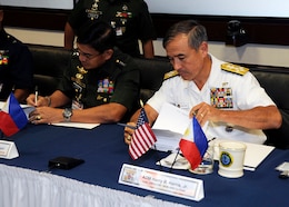 CAMP H.M. SMITH, Hawaii - Chief of Staff of the Armed Forces Philippines, Gen. Hernando Iriberri, and the Commander of U.S. Pacific Command, Adm. Harry Harris Jr., endorse the U.S. and Philippine bilateral calendar for 2016. Gen. Iriberri visited USPACOM to co-chair the Mutual Defense Board and Security Engagement Board with Adm. Harris.  Held annually since 1958, the boards provide a venue for strategic discussions on shared security topics.  Board members consist of the U.S. and Philippine Service commanders, Philippine Coast Guard, Philippine National Police, Joint Interagency Task Force- West  and the U. S. Coast Guard - Pacific Area.  Following the discussions, the co-chairs endorse the bilateral activities for the upcoming year. 