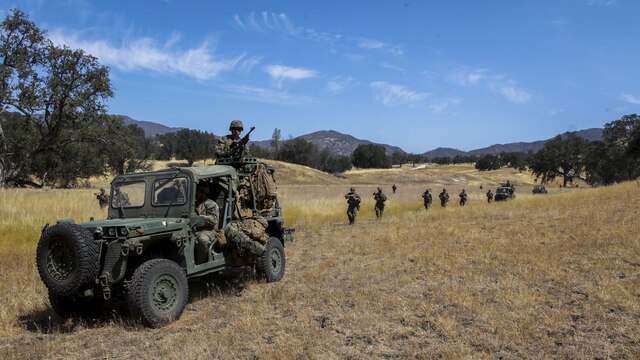 Marines with Company B, 1st Battalion, 1st Marine Regiment, 1st Marine Division, conduct a patrol at Fort Hunter Liggett, Calif., Aug. 25, 2015. The patrol was conducted as part of an experimental exercise designed to test Internally Transported Vehicle (ITVs) capabilities and discuss areas for improvement. The Marine Corps Warfighting Lab established the exercise to aid in the process of getting reliable information for future vehicle designs.