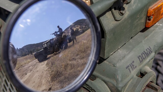 Marines with Company B, 1st Battalion, 1st Marine Regiment, 1st Marine Division, hold sections of fire on a ridge line at Fort Hunter Liggett, Calif., Aug. 25, 2015. The Marines were patrolling as part of an experimental exercise designed to test Internally Transported Vehicle (ITVs) capabilities and discuss areas for improvement. The Marine Corps Warfighting Lab established the exercise to aid in the process of getting reliable information for future vehicle designs.